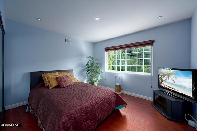 bedroom featuring dark hardwood / wood-style floors