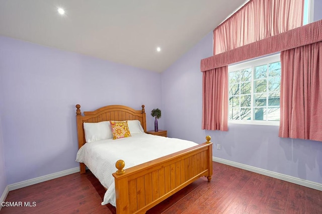 bedroom featuring vaulted ceiling and dark hardwood / wood-style floors