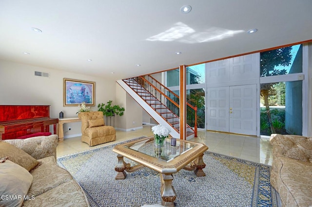 tiled living room featuring expansive windows