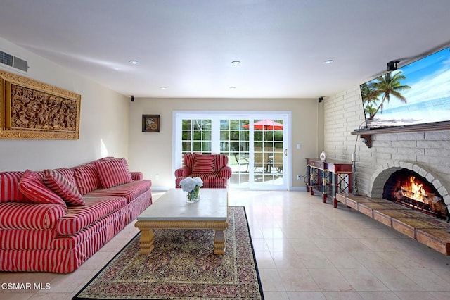 tiled living room featuring a fireplace