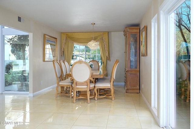 dining space featuring light tile patterned floors