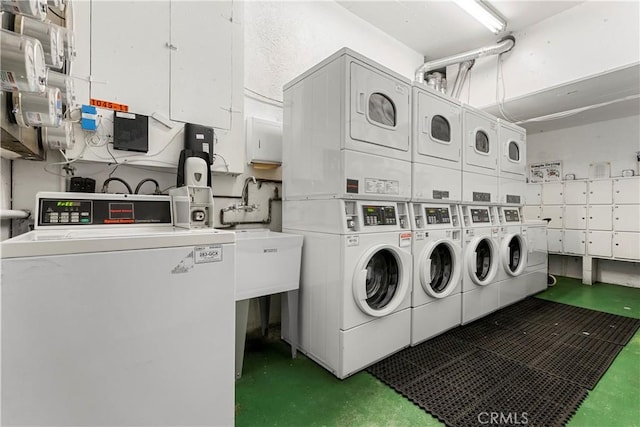 laundry area with stacked washing maching and dryer and washer and dryer