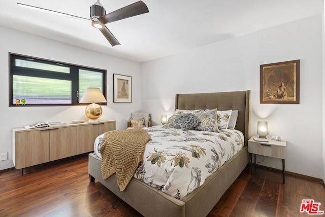 bedroom featuring ceiling fan and dark hardwood / wood-style flooring