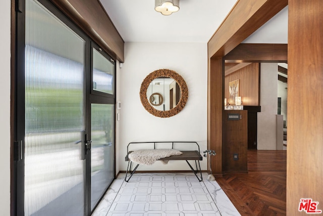 hallway featuring light parquet flooring