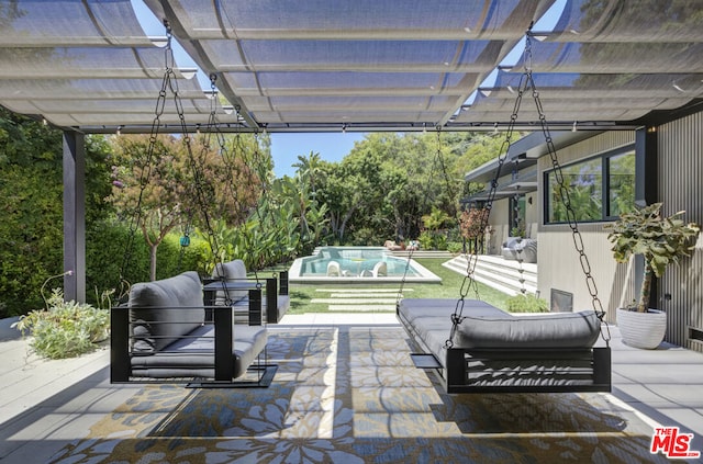 view of patio with a pool, outdoor lounge area, and a pergola