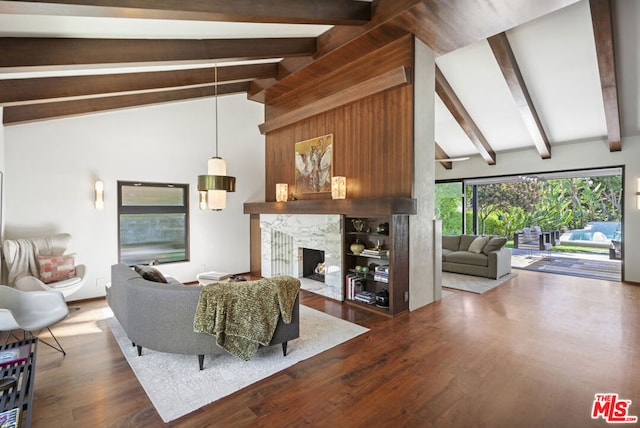 living room featuring dark wood-type flooring, a fireplace, and lofted ceiling with beams