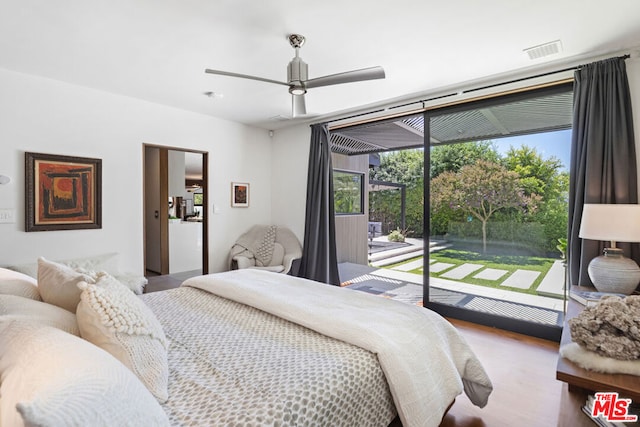 bedroom featuring wood-type flooring, access to outside, and ceiling fan