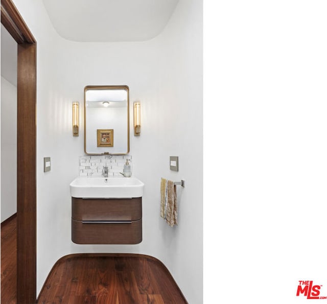 bathroom with vanity and wood-type flooring