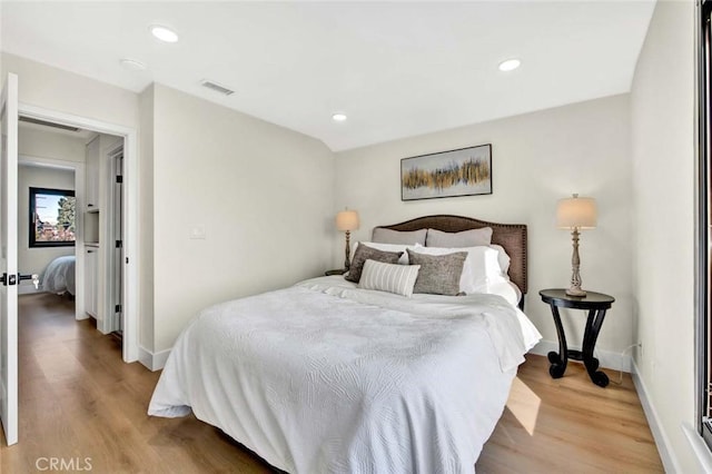 bedroom featuring light wood-style floors, baseboards, and recessed lighting