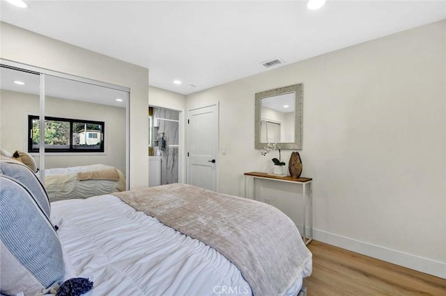 bedroom with recessed lighting, light wood-type flooring, visible vents, and baseboards