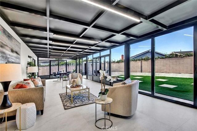 sunroom / solarium featuring coffered ceiling and beam ceiling