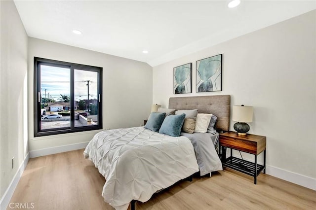 bedroom featuring recessed lighting, baseboards, and light wood finished floors