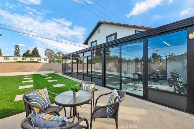 view of patio featuring fence