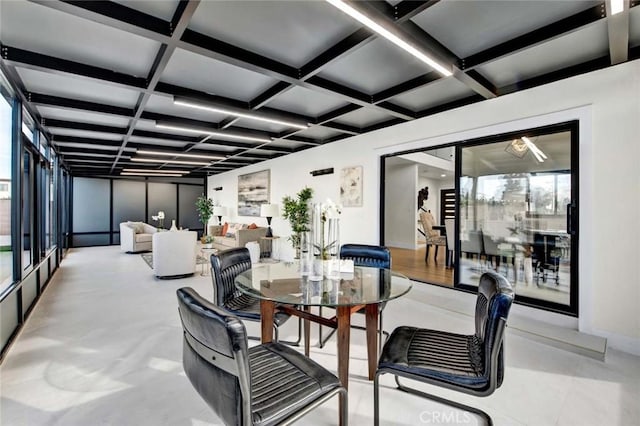 dining space with beam ceiling and coffered ceiling