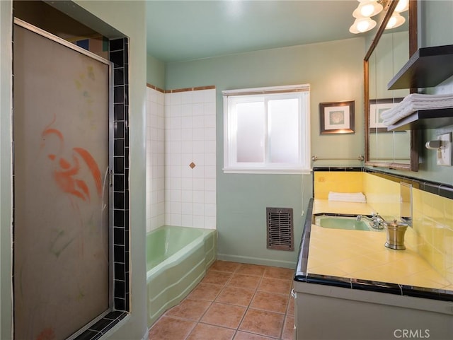 bathroom featuring vanity, tile patterned floors, and shower with separate bathtub