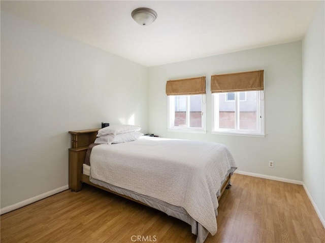 bedroom with light hardwood / wood-style flooring