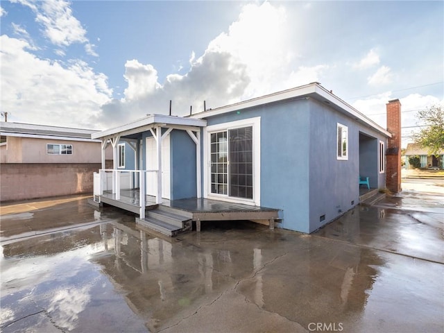 back of house featuring a patio area