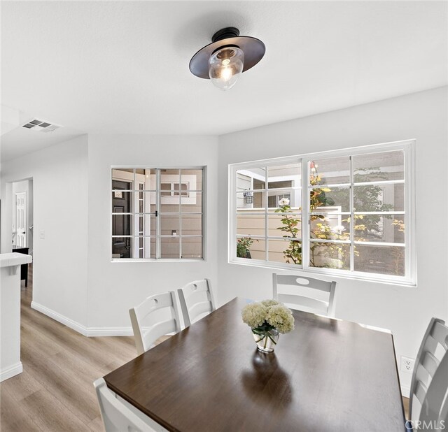 dining room with light wood-type flooring