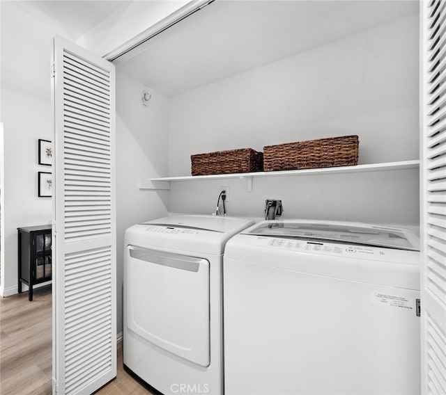 33144 Ocean Rdg, Dana Point, CA 92629 - clothes washing area with independent washer and dryer and light wood finished floors