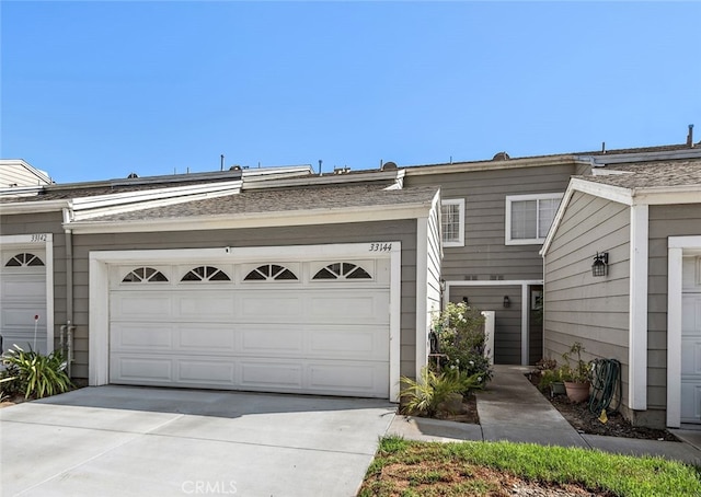 view of front facade with driveway and an attached garage