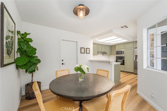 33144 Ocean Rdg, Dana Point, CA 92629 - dining area with light wood finished floors and baseboards