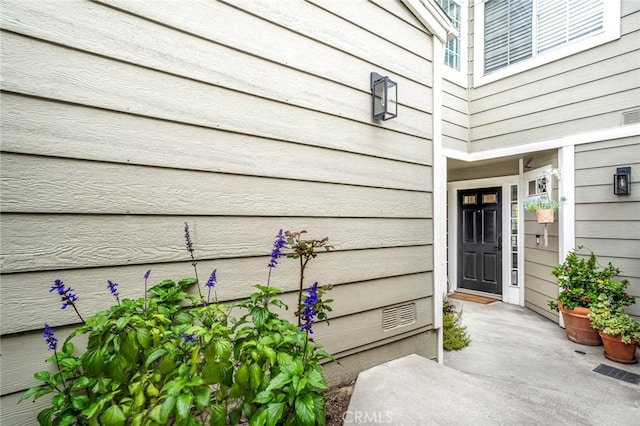 doorway to property with visible vents