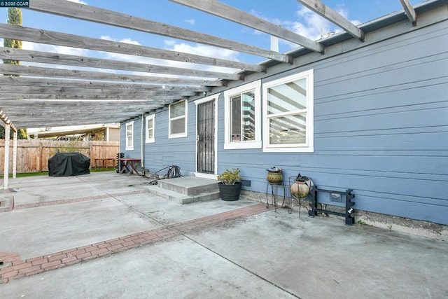 view of patio featuring a grill and a pergola