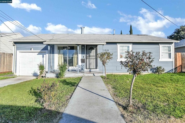 ranch-style house with a garage, a front yard, and covered porch