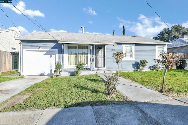 single story home featuring a garage and a front yard