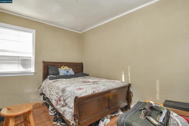 bedroom with ornamental molding