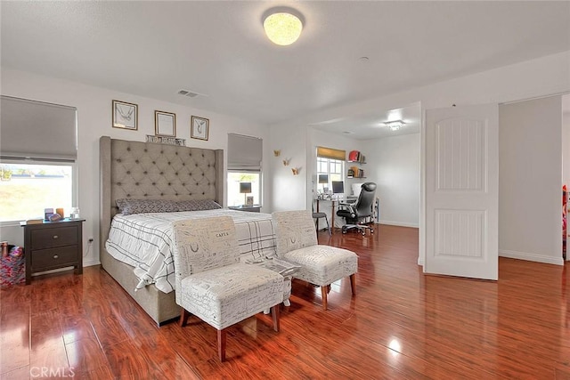 bedroom with hardwood / wood-style flooring