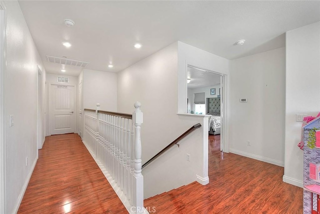 hallway with wood-type flooring