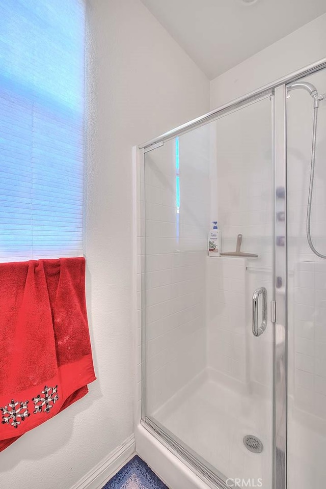 bathroom featuring an enclosed shower