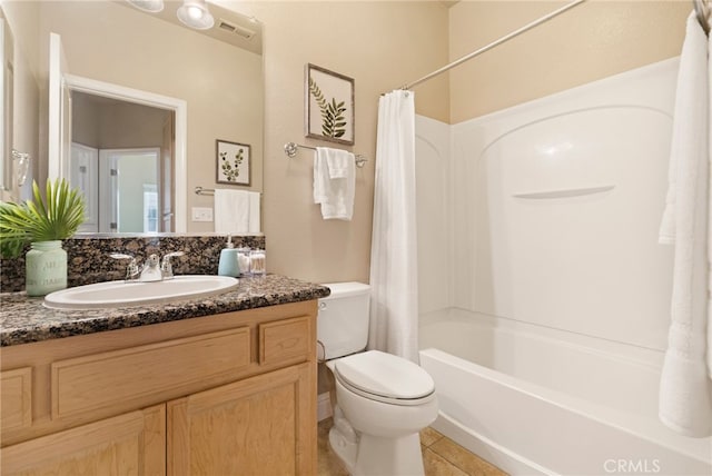 full bathroom featuring vanity, shower / tub combo, tile patterned floors, and toilet