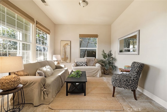 tiled living room featuring plenty of natural light