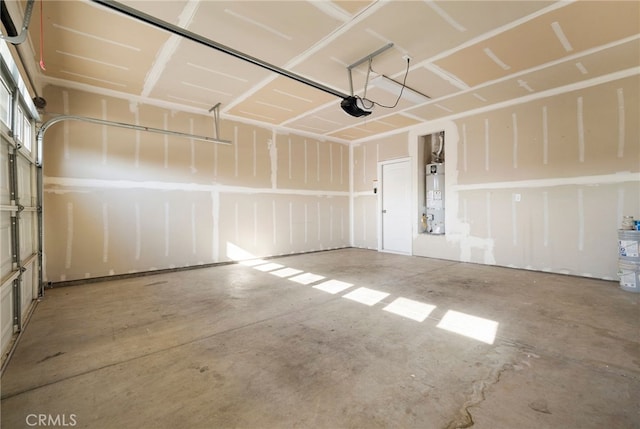 garage featuring a garage door opener and gas water heater