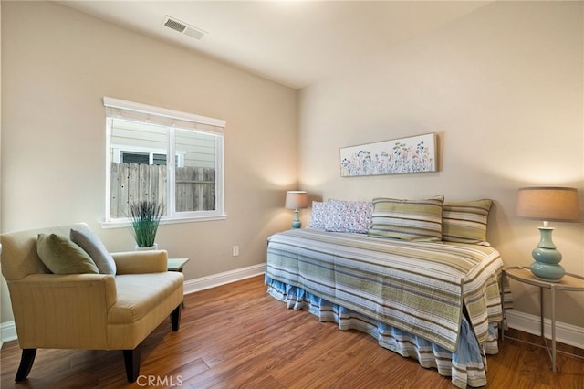 bedroom with wood-type flooring