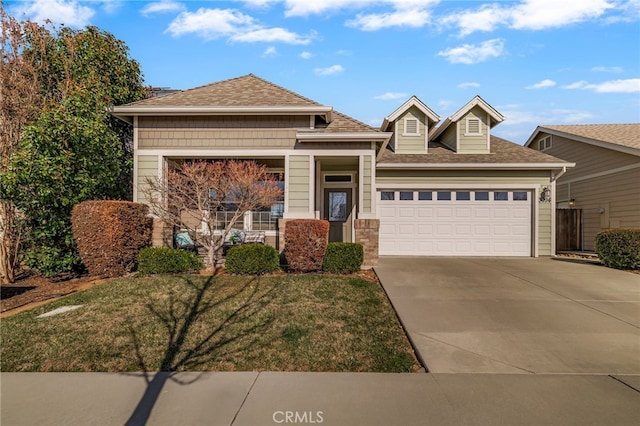 view of front of property with a garage and a front yard