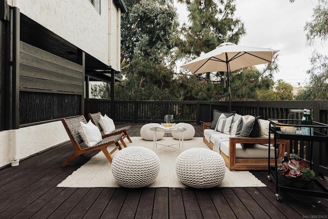 wooden deck with an outdoor hangout area