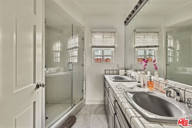 bathroom with an enclosed shower and vanity