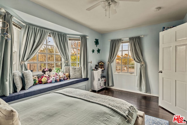 bedroom featuring dark hardwood / wood-style flooring and ceiling fan