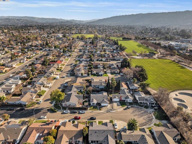 birds eye view of property with a mountain view