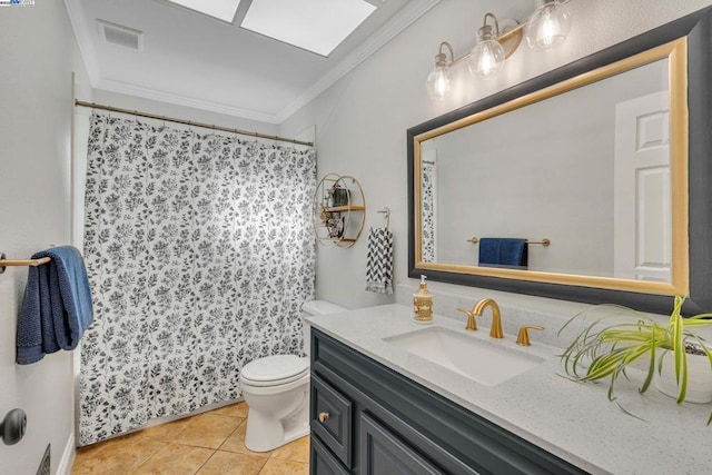 bathroom featuring vanity, tile patterned flooring, crown molding, and toilet