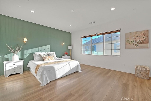 bedroom with light hardwood / wood-style flooring