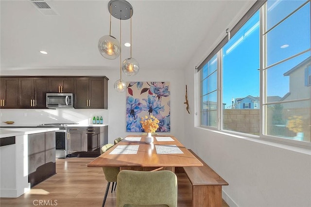 dining area with light wood-type flooring