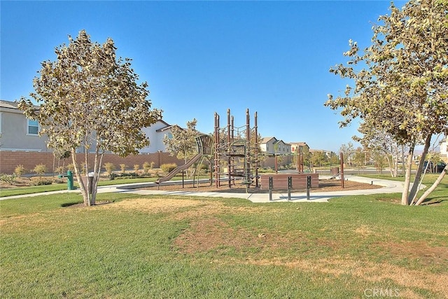 surrounding community with a playground and a lawn