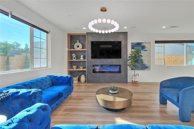 living room featuring a fireplace and wood-type flooring