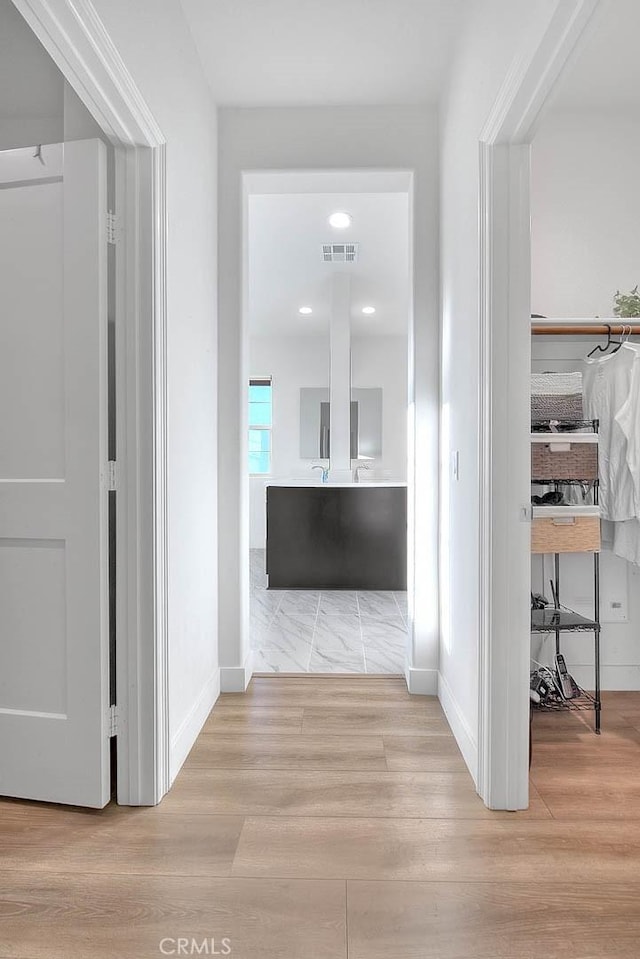 hallway featuring light wood-type flooring