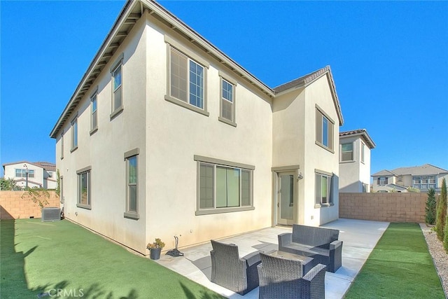 rear view of property featuring central AC unit, a lawn, outdoor lounge area, and a patio area