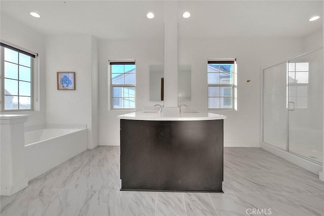 bathroom featuring independent shower and bath and vanity